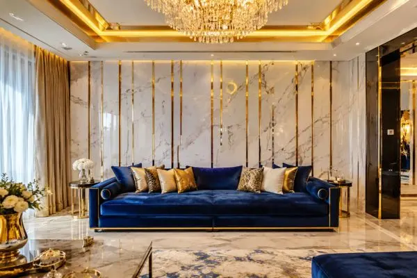 Royal blue velvet daybed sofa with gold cushions