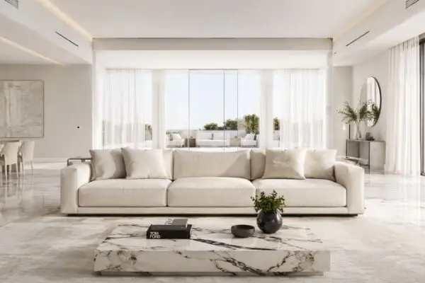 Bright and airy living room with a cream sofa and floor-to-ceiling windows