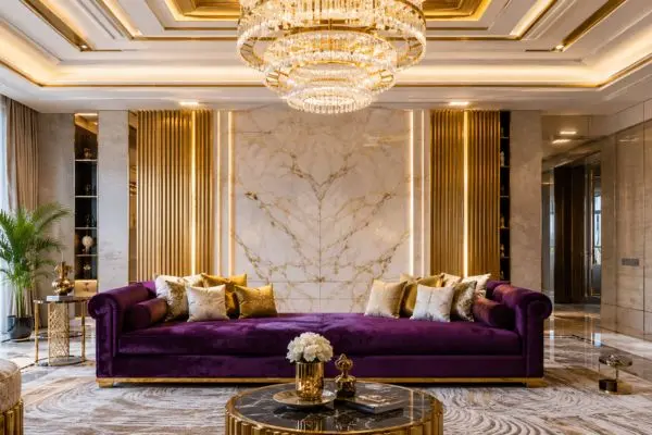 Rich purple velvet seating with gold cushions in modern luxury hall