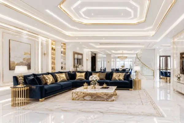 Premium custom seating setup in a bright white living space with geometric gold lighted ceiling panels.