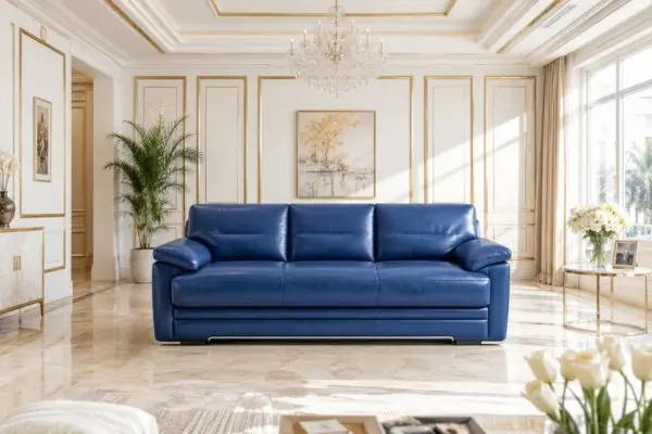 royal blue leather sofa bed with convertible base in a bright luxury white and gold living room