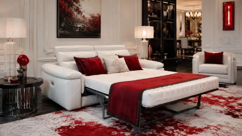 white leather sofa bed extended into a sleeper bed in red and white luxury living room