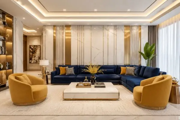 Modern luxury navy blue and mustard yellow seating arrangement with champagne gold wall details