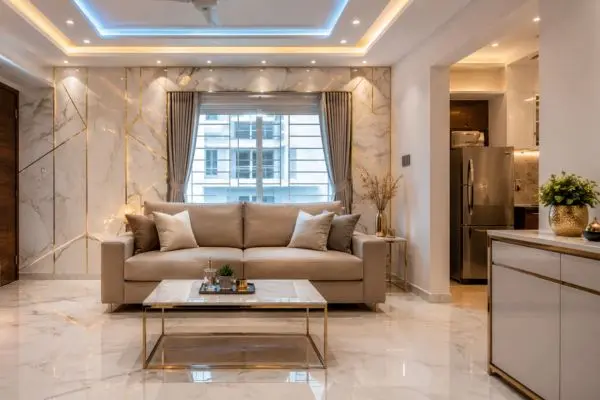 Soft taupe sofa floated away from walls and placed below a window in a small luxury room.