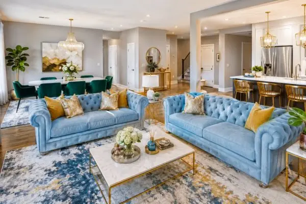 Light blue sofa in a bright modern apartment living room layout
