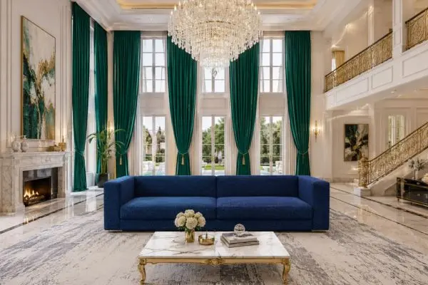 A single modern tuxedo-style azure bouclé lounge couch inside a luxury mansion hall with tall emerald green curtains.