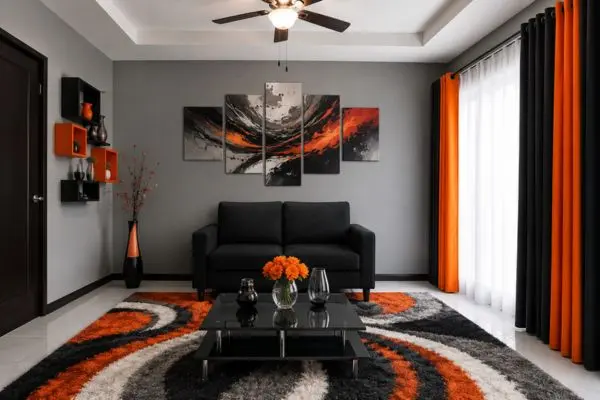 Compact black fabric sofa in a modern grey and orange abstract living room.