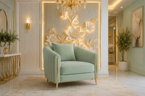 Elegant mint green single sofa chair with gold trim in a luxury living room.