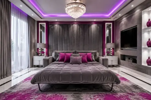 Comfortable unfolded grey and magenta folding couch padding layout shown in a modern neon-lit bedroom.