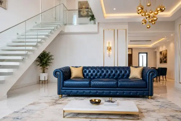 Various types of blue leather sofas inside a luxury modern home layout.