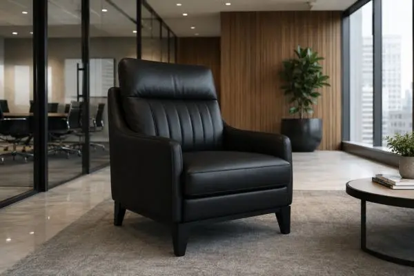 Premium black leather office sofa chair in a modern corporate lounge.