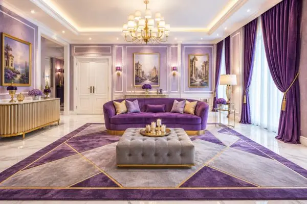 A modern purple small curved sofa with a gold base in a luxury purple living room.