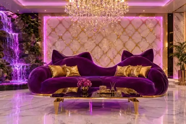 Luxurious royal purple velvet whimsical feline seating near an indoor waterfall with neon ambient lighting.
