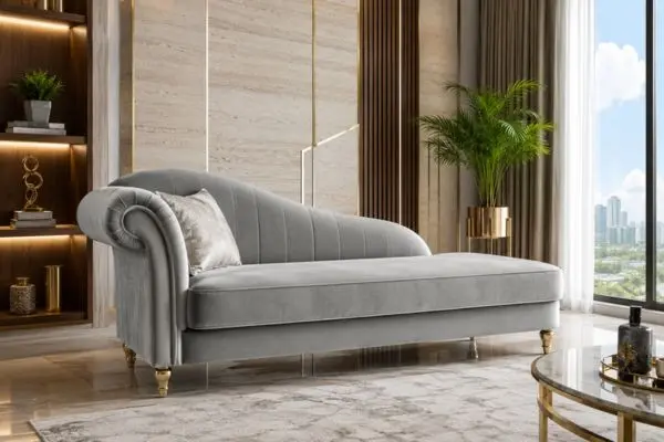Luxury silver-grey velvet chaise lounge sofa in a premium living room with walnut wood paneling.
