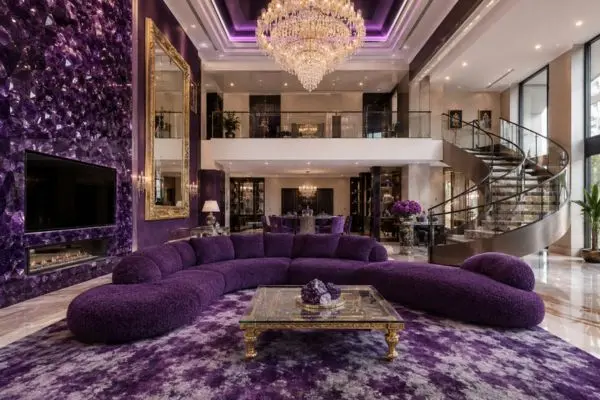 A single royal purple curved teddy sofa in a luxury crystal living room