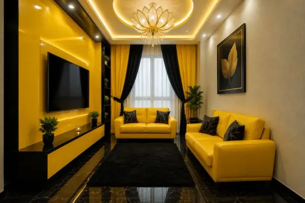 Compact yellow leather sofas arranged neatly in a narrow small flat living room with black marble flooring.